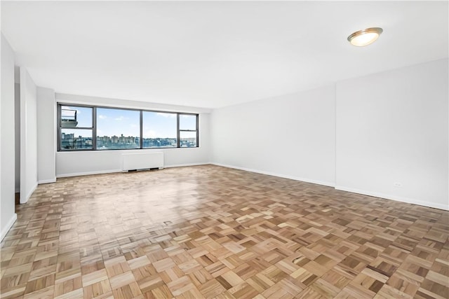 interior space featuring parquet flooring and radiator