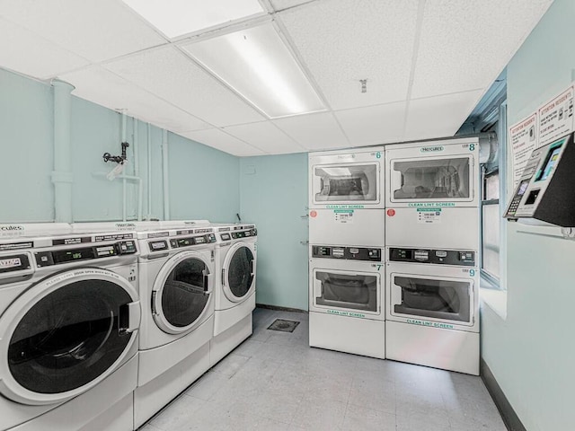 clothes washing area featuring washing machine and dryer and stacked washer / drying machine