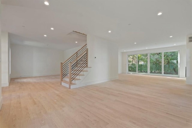 unfurnished living room featuring light wood-type flooring