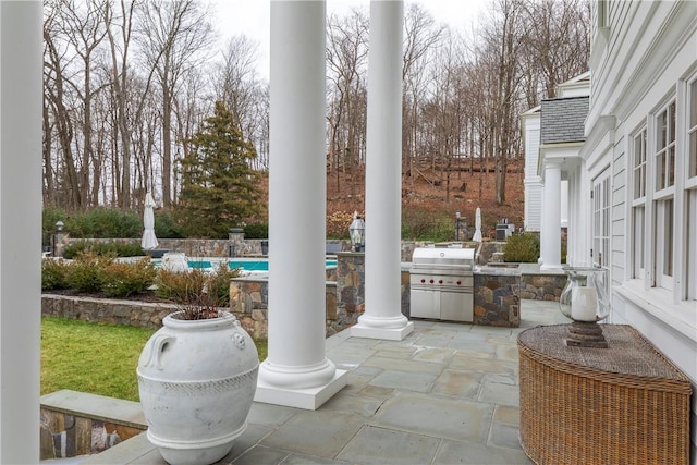 view of patio / terrace featuring area for grilling and exterior kitchen