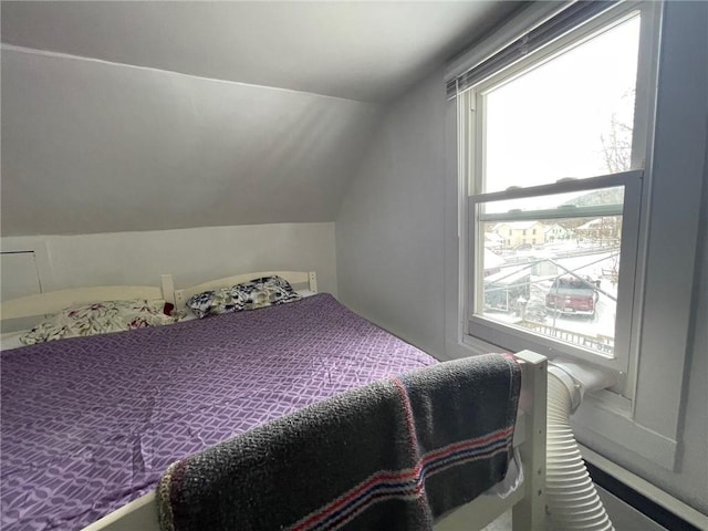 bedroom featuring vaulted ceiling