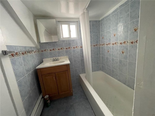 bathroom featuring tile patterned flooring, vanity, shower / bathtub combination with curtain, and tile walls