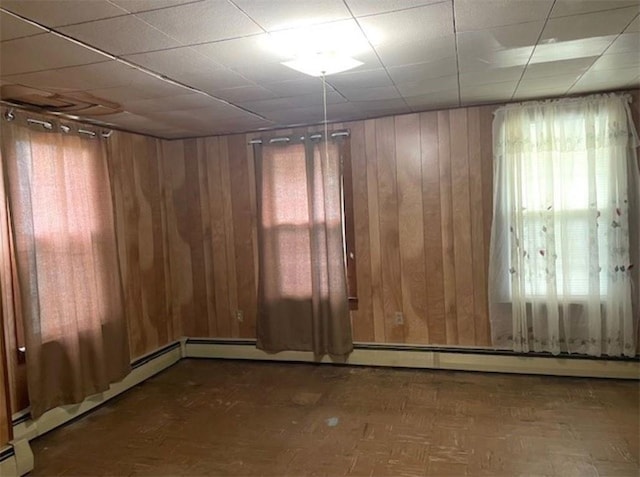 empty room featuring wooden walls