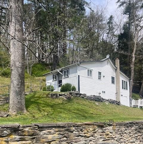 view of home's exterior featuring a yard