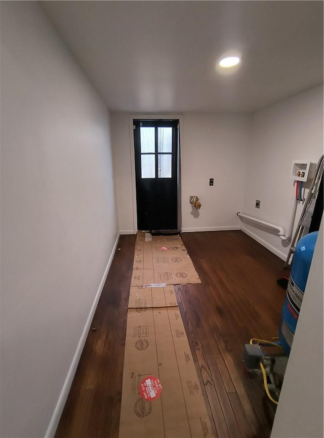 doorway to outside featuring dark wood-type flooring