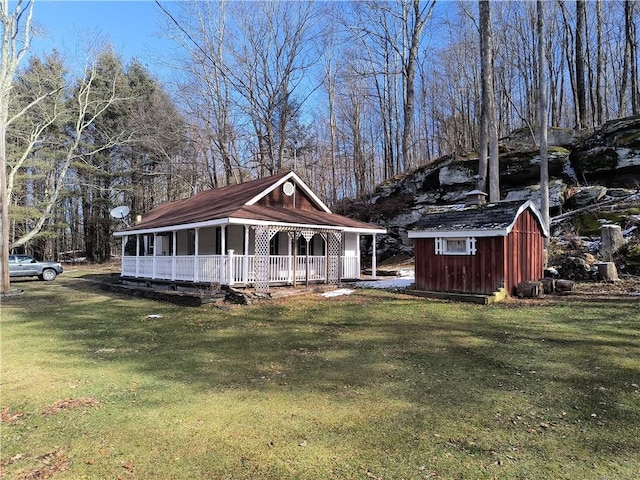 view of front of property with covered porch and a front yard