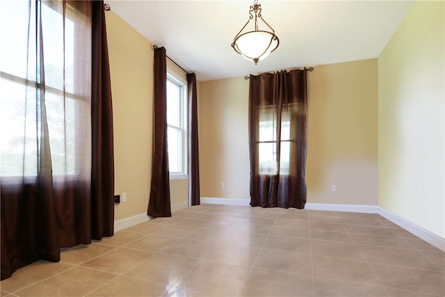 spare room with light tile patterned floors