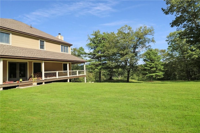 view of yard with a wooden deck