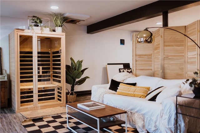 interior space featuring beamed ceiling and hardwood / wood-style flooring