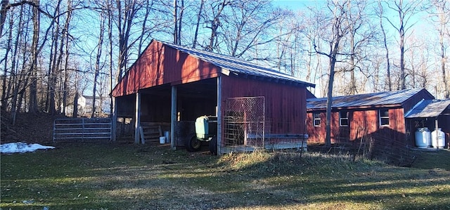 view of outbuilding with a lawn