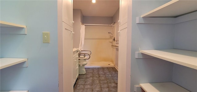 bathroom with toilet and curtained shower