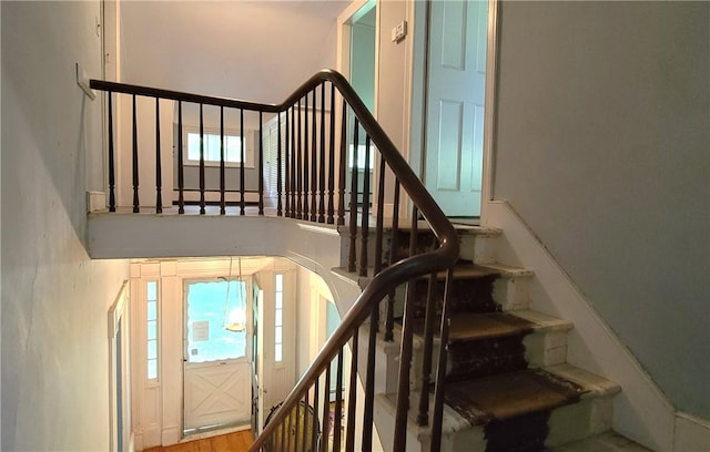 stairs with wood-type flooring