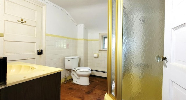 bathroom featuring a baseboard radiator, walk in shower, toilet, vanity, and tile walls