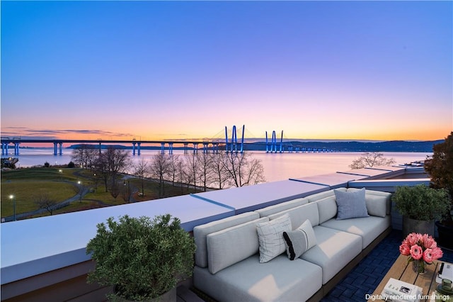 exterior space with outdoor lounge area and a water view