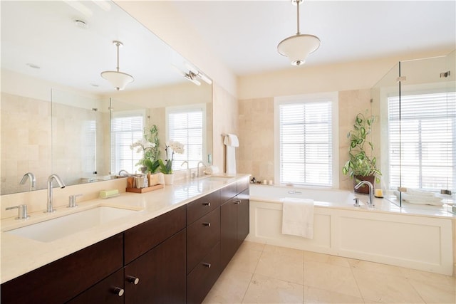 bathroom with tile patterned flooring, shower with separate bathtub, and vanity