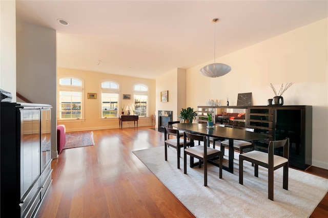 dining area with wood finished floors and baseboards