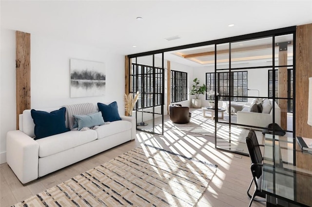 living room with light hardwood / wood-style flooring