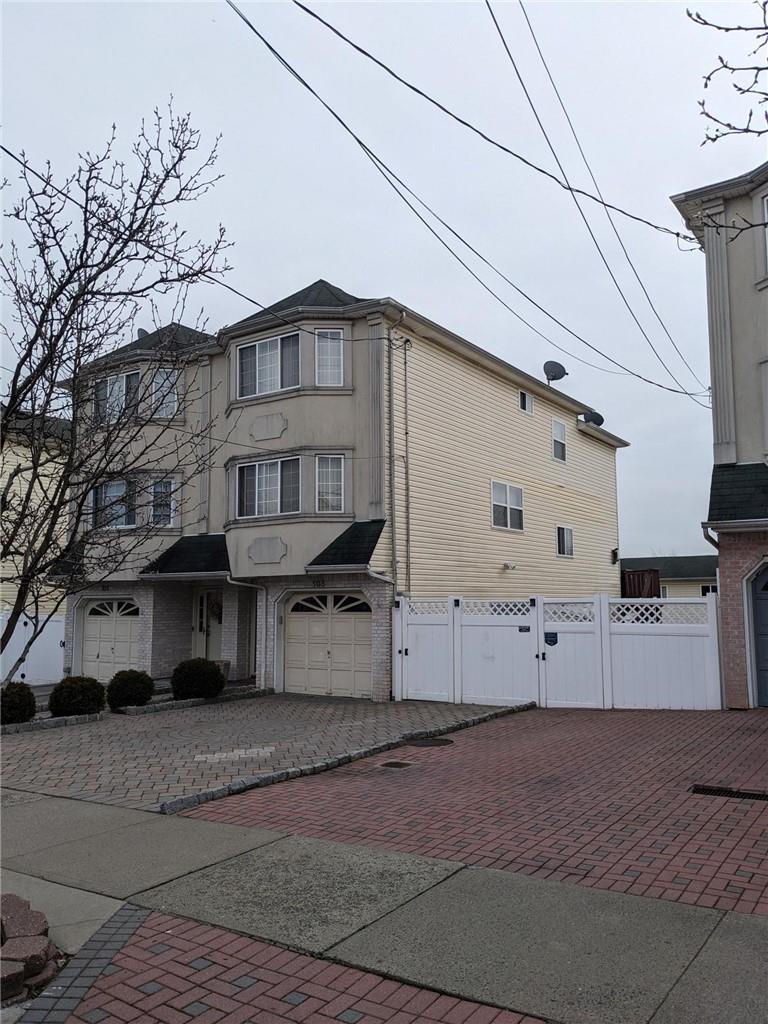 view of side of property featuring a garage