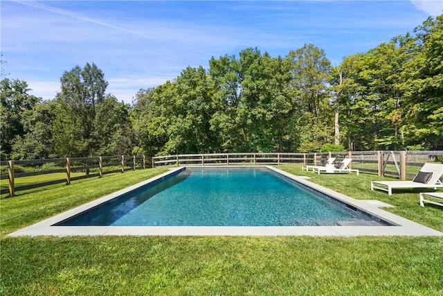 view of pool featuring a yard