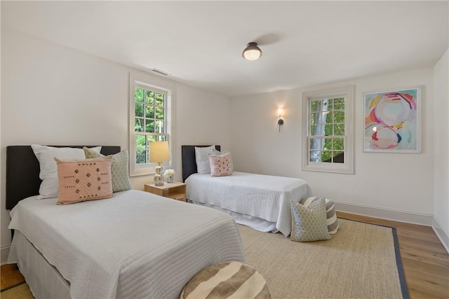 bedroom featuring wood-type flooring