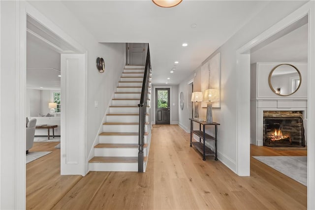 stairs with hardwood / wood-style flooring