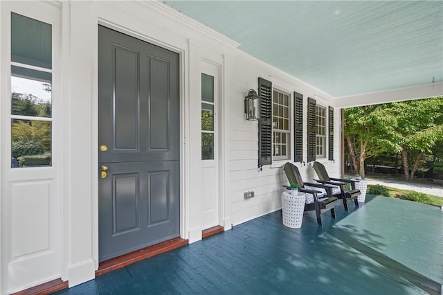 entrance to property with a porch