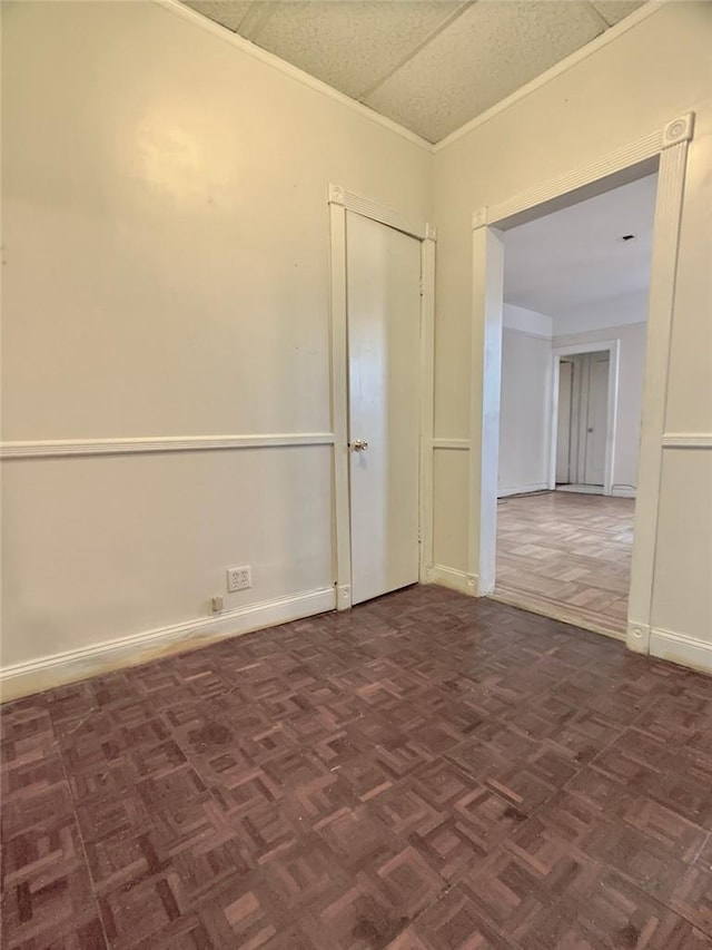 unfurnished room featuring dark parquet floors