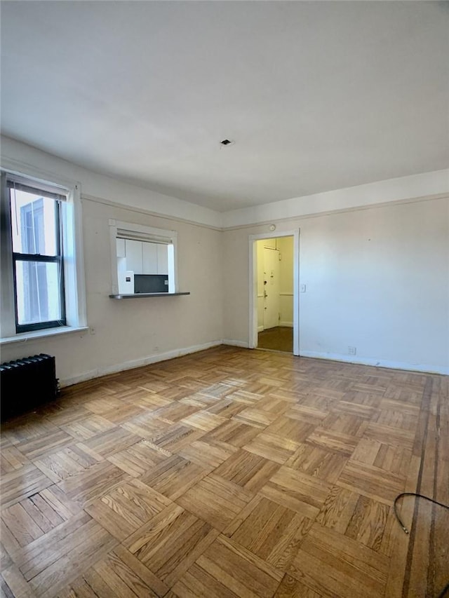 spare room with light parquet flooring