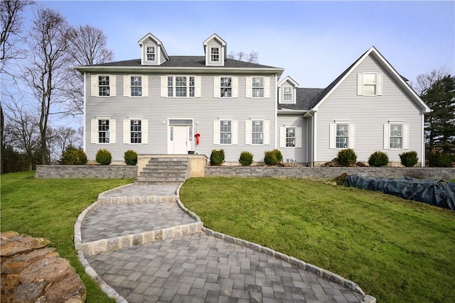 colonial home with a front lawn