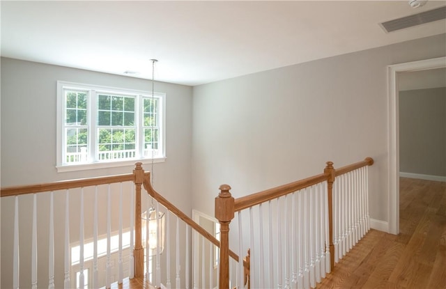 corridor featuring hardwood / wood-style floors