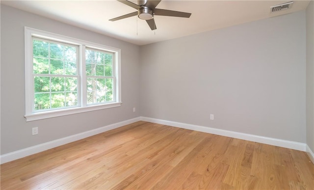 spare room with ceiling fan and light hardwood / wood-style flooring