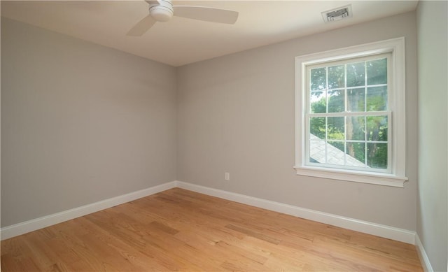 empty room with light hardwood / wood-style floors and ceiling fan