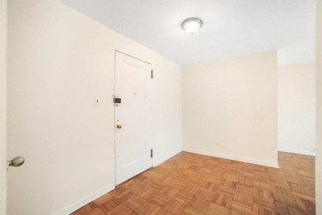 spare room with light parquet floors