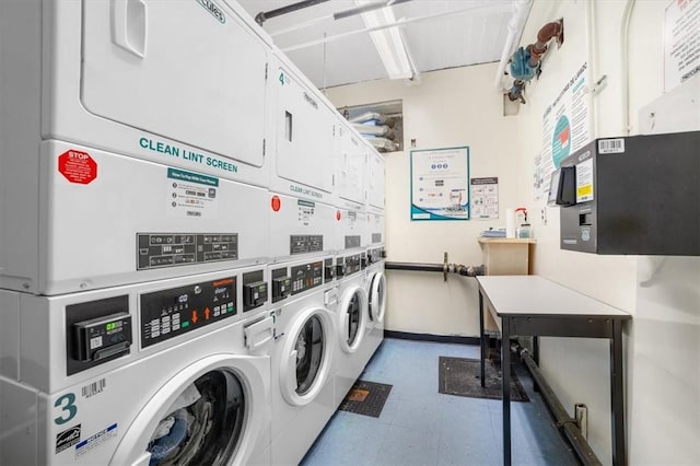 laundry room with washing machine and dryer and stacked washer and clothes dryer