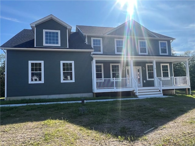 view of front of house featuring a porch and a front yard