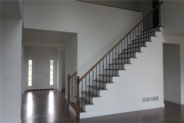 foyer entrance with dark wood-type flooring