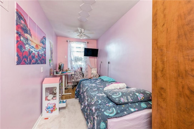 carpeted bedroom with ceiling fan