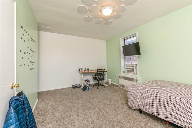 carpeted bedroom with radiator heating unit and ceiling fan