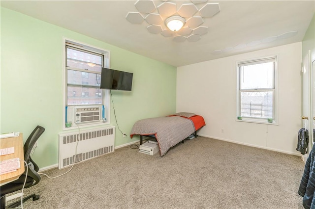 carpeted bedroom featuring radiator and cooling unit