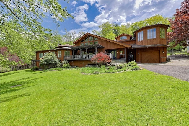 view of front facade with a garage and a front lawn