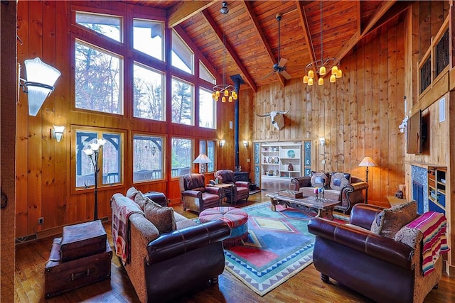 living room featuring hardwood / wood-style flooring, a healthy amount of sunlight, and wooden walls