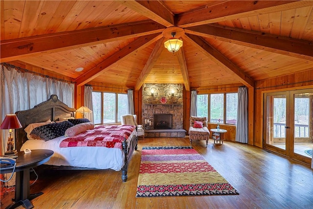 bedroom featuring access to outside, multiple windows, wooden ceiling, and hardwood / wood-style flooring