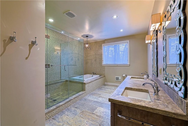 bathroom featuring vanity and plus walk in shower