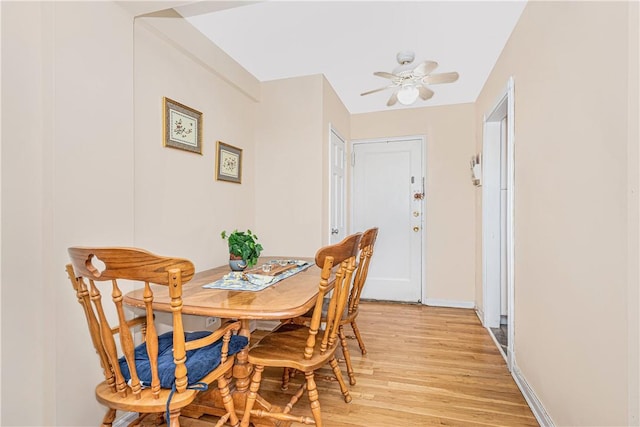 dining area featuring light hardwood / wood-style floors and ceiling fan