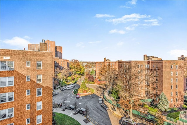 5615 Netherland Ave Unit 6G, Bronx, NY 10471 - view of apartment building / complex featuring uncovered parking and a view of city