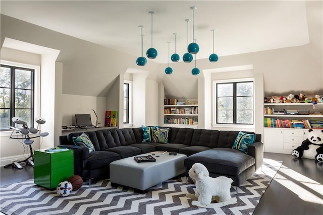 living room with a healthy amount of sunlight and hardwood / wood-style flooring