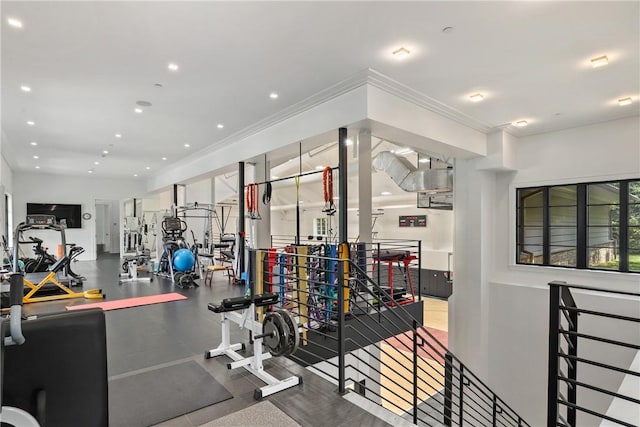 exercise room featuring ornamental molding