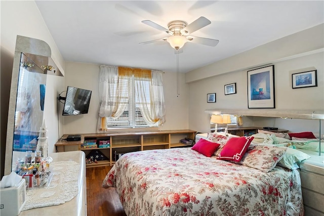 bedroom featuring ceiling fan and dark hardwood / wood-style floors