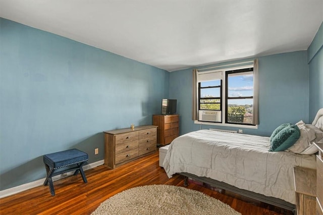 bedroom featuring dark hardwood / wood-style flooring