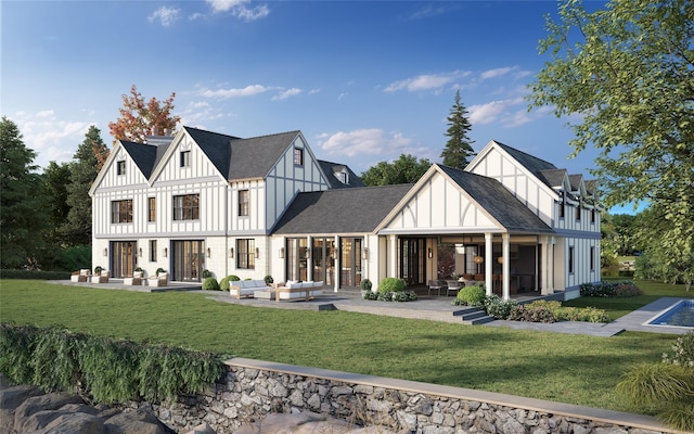 rear view of house with a patio, outdoor lounge area, roof with shingles, a lawn, and board and batten siding